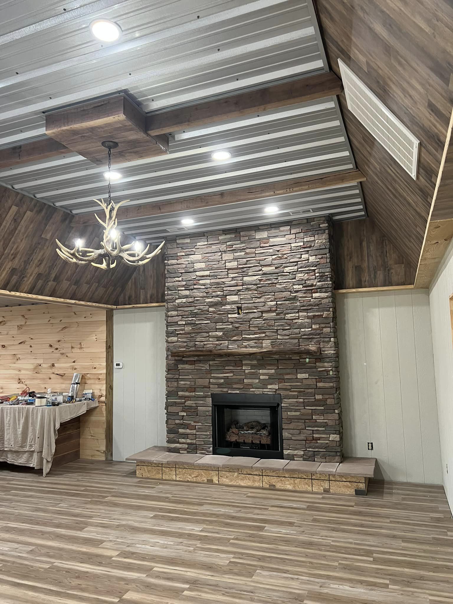 Warm interior of the Kentucky hunting lodge with rustic wood walls and comfortable seating.