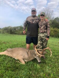 Hunter and guide celebrate a successful Kentucky whitetail hunt.